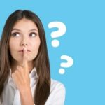 Woman thinking about bite problems with question marks on blue background.