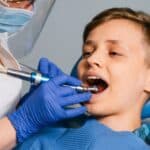 Young boy receiving dental treatment from pediatric dentist in Spring.