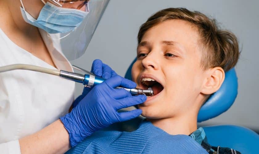 Young boy receiving dental treatment from pediatric dentist in Spring.
