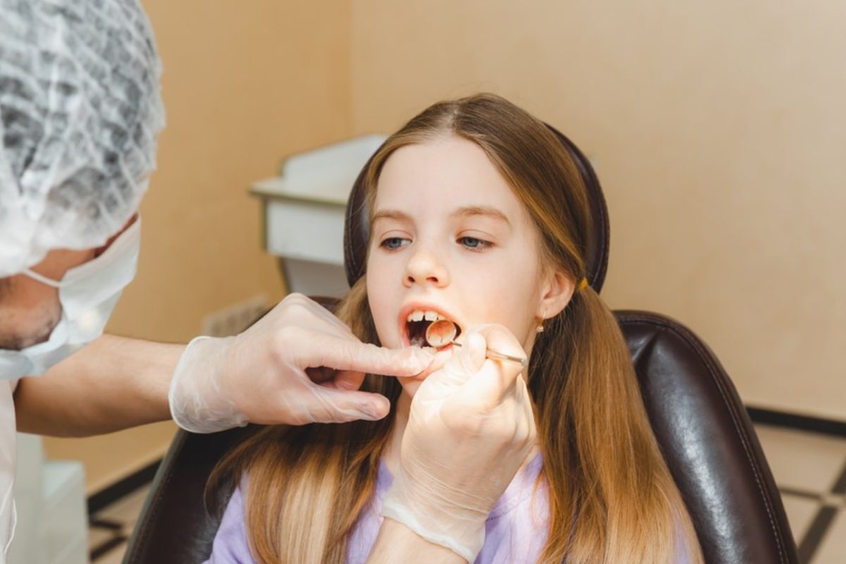 Young patient receiving dental examination in Spring, TX dental office.